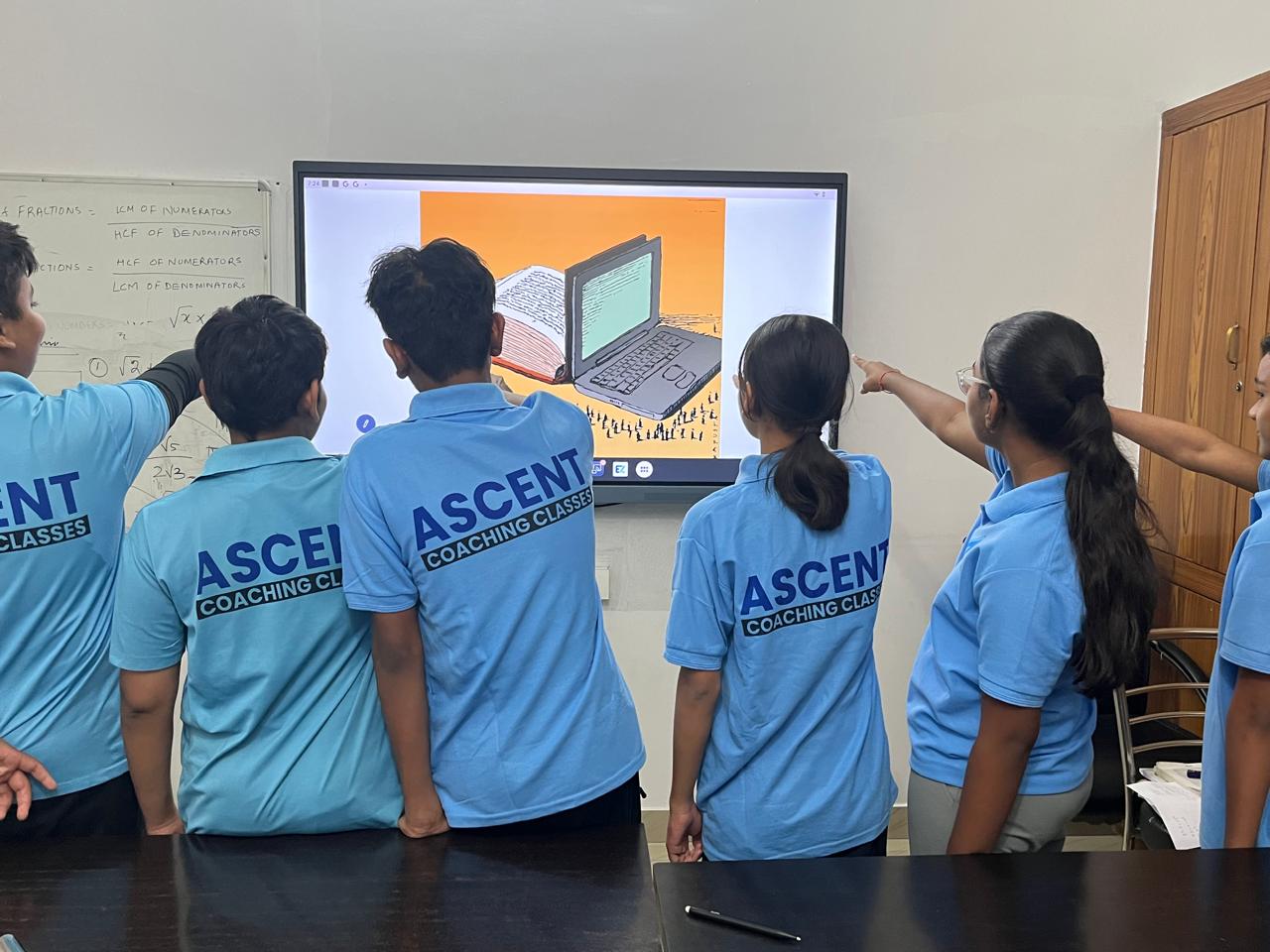 Students interacting with smart boards at Ascent Coaching Classes